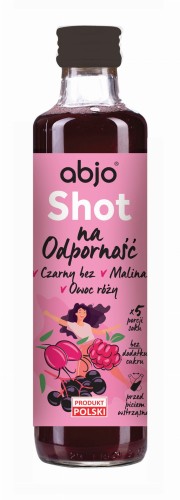 Butelka shotu Abjo na odporność z czarnym bzem, maliną i owocem róży. Ilustracja przedstawia uśmiechniętą kobietę wśród składników.